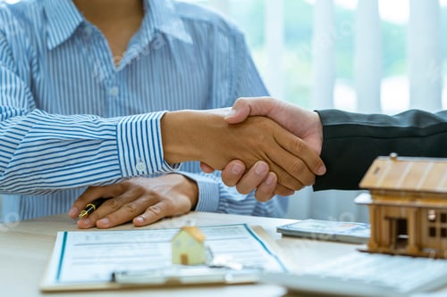 Preview: Real estate broker and client sign contract insurance agreement document. Business meeting concept,