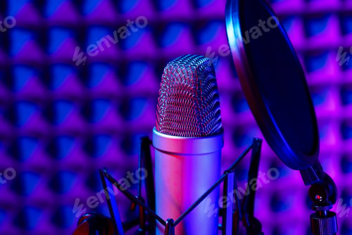 Preview: Professional studio microphone against acoustic foam panel background in neon light