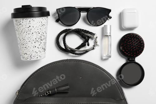 Preview: Stylish urban backpack with different items on white background, flat lay
