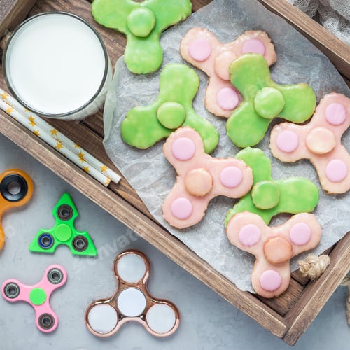 Preview: Homemade shortbread cookies made in trendy spinner toy form, top view, square