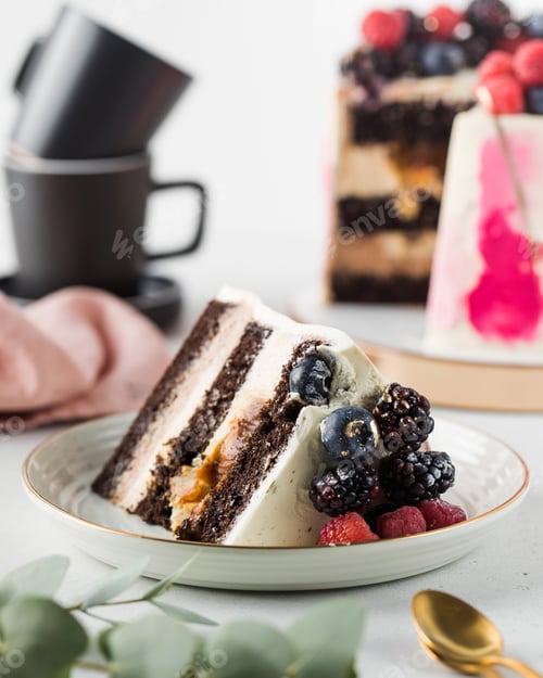 Preview: A piece of chocolate cake with caramel and fresh berries on a plate.