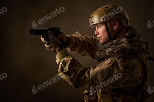 Preview: portrait of an airsoft soldier in camouflage clothing with an airsoft gun
