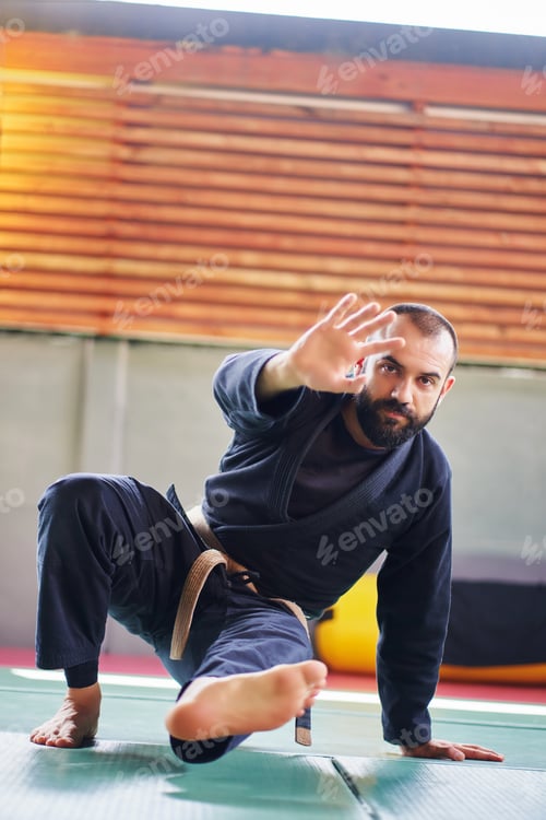 Preview: Jiu-jitsu athlete performing defensive maneuver during training session