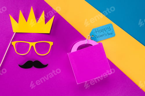 Preview: top view of king face with gift box with Happy fathers day tag on colorful surface