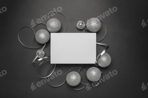 Preview: Closeup of Christmas decorations on a black background with a white copy space