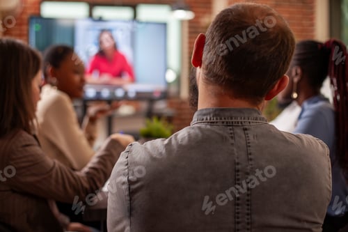 Preview: Bearded man looks at video call on screen