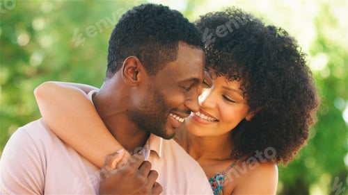 Preview: Romantic Couple Embracing in Nature During a Sunny Afternoon