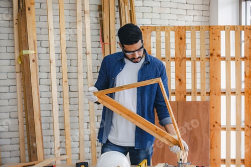 Preview: Carpenter working in carpentry shop