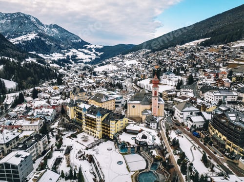 Preview: Aerial drone view of the Ortisei town covered in snow in northern Italy