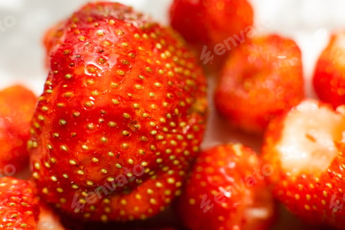 Preview: Macro of strawberries texture in sunlight