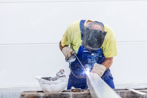 Preview: Worker welding in a factory.