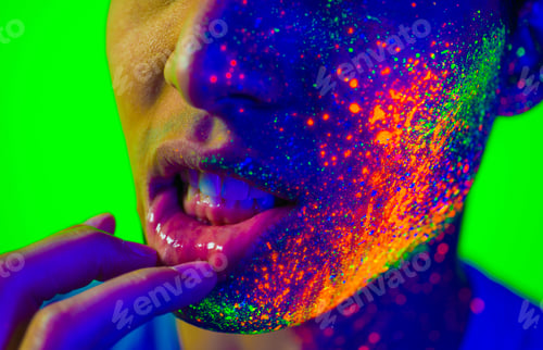 Preview: Fashion model with fluo painting on the face