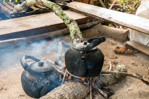 Preview: Vintage traditional kettle for boiling water on Wood sticks