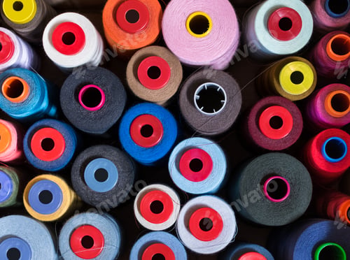 Preview: Top down view on different colors of cashmere yarn on reels