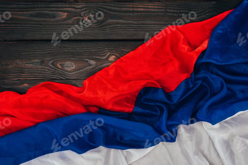 Preview: close up view of russian flag on dark wooden surface