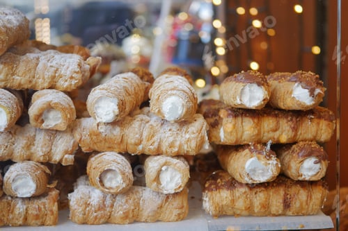 Preview: An assortment of scrumptious creamfilled pastries, beautifully displayed in a bakery