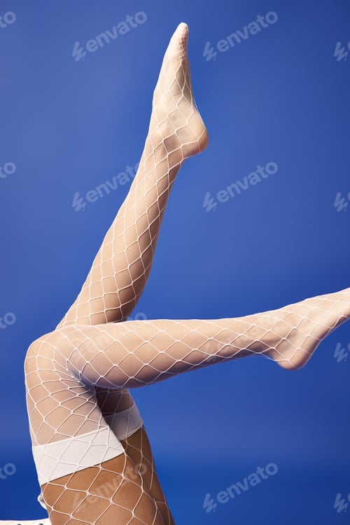 Preview: Ethereal elegance: woman in white fishnet stockings