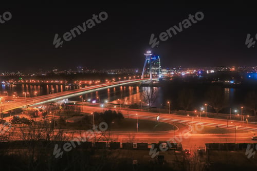 Preview: Night view of the illuminated UFO Bridge over the Danube River in Bratislava
