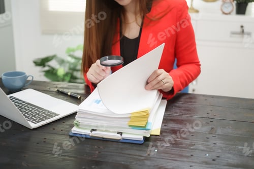 Preview: A cheerful businesswoman works her office desk as a legal consultant,handling online civil cases