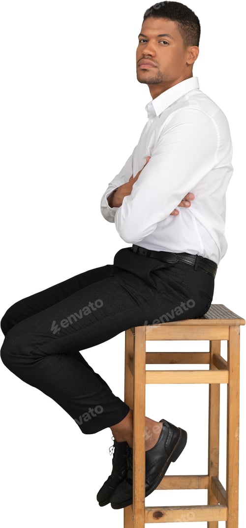 Preview: a man is sitting on a wooden chair