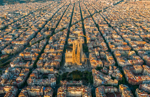 Preview: Aerial view of Barcelona Eixample residential district and Sagrada Familia Basilica at sunrise