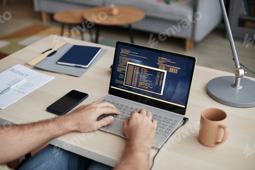 Preview: Unrecognizable Man Typing at Computer Keyboard and Writing Code