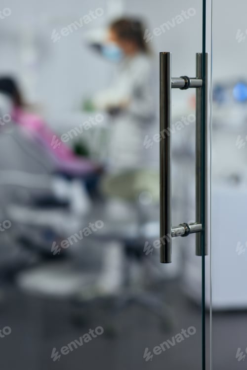 Preview: Glass door of dentist's Office