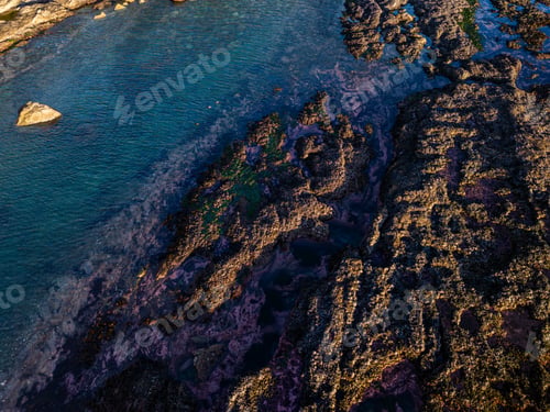 Preview: Vibrant Tidal Pools on Rocky Shoreline of Vancouver Island at Sunset