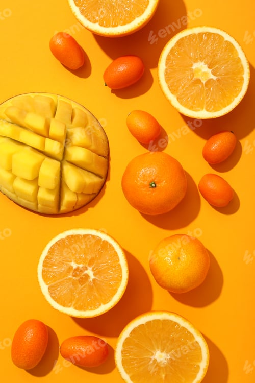 Preview: Set of tropical fruits on yellow background, top view