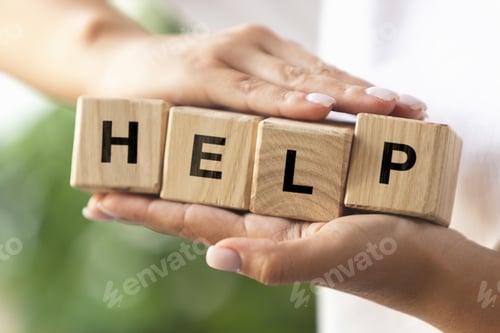 Preview: Female hands holding wooden cubes, blocks word HELP. Conceptual image about human rights, education