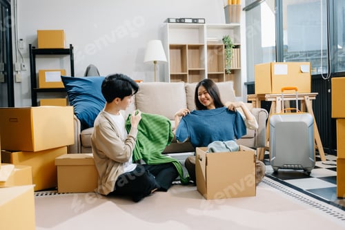 Preview: Asian young attractive couple man and woman use tablet and smartphone online shopping furniture