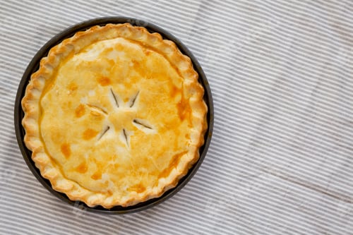 Preview: A Piece of Chicken Pot Pie, top view. Flat lay, overhead, from above. Copy space.