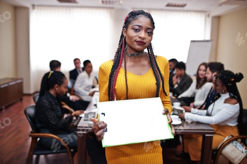 Preview: Multiracial young creative people in modern office