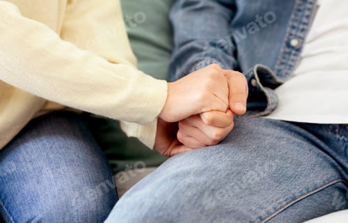 Preview: Close Up of Two People Holding Hands