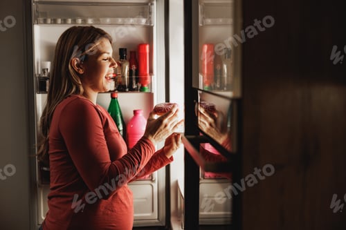 Preview: Expecting Woman Eating Donut At Night