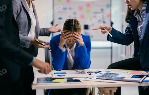 Preview: Businesswoman is feeling stressed while her coworkers are being aggressive and blaming her for somet