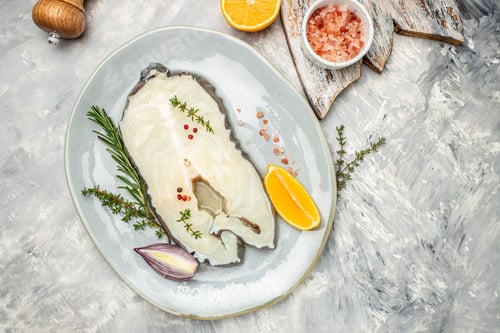 Preview: Fillet of fresh sea white cod fish steak Anarhichas on plate