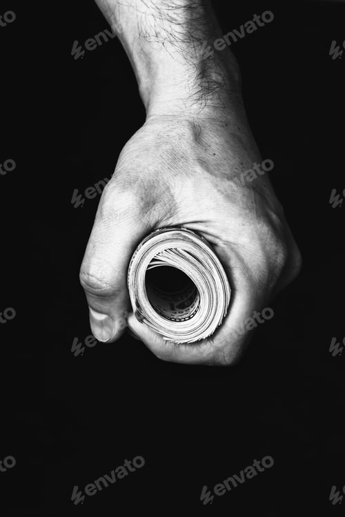 Preview: Roll of hundred us dollars in male fist
