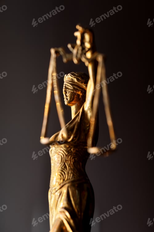 Preview: statuette of the Greek goddess of justice Themis in profile on a dark background