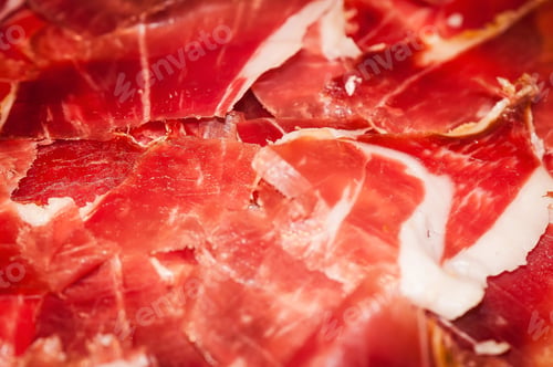 Preview: Closeup shot of red meat spread on the surface - perfect for a recipe article