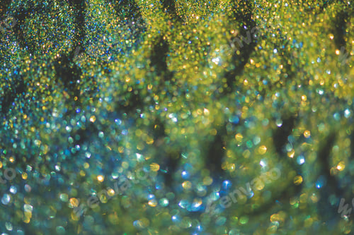 Preview: Abstract glitter lights colorful bokeh background in blue,gold and yellow color tones