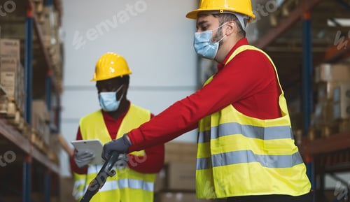 Preview: Team working in warehouse doing inventory using digital tablet loading delivery boxes