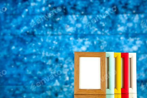 Preview: front view different picture frames with colored corners on blue background picture portrait family