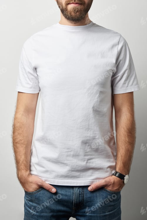 Preview: cropped view of man with hands in pockets in white t-shirt with copy space isolated on grey