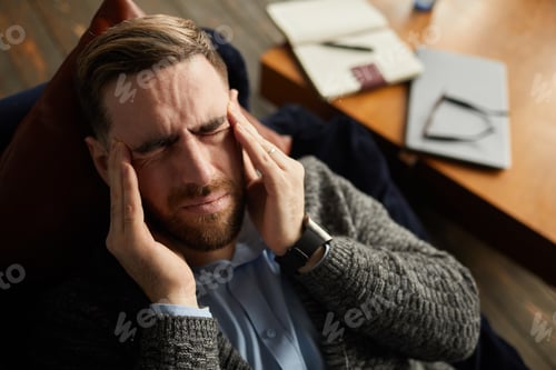 Preview: Businessman has a headache
