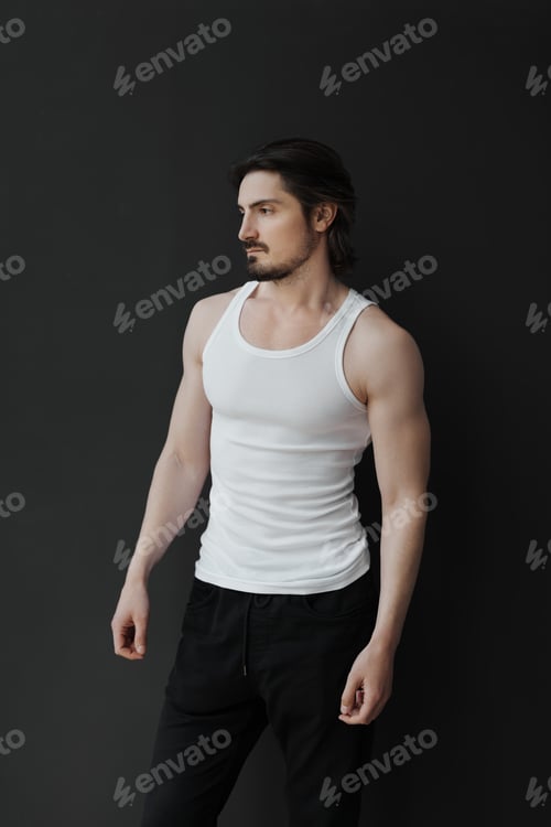 Preview: Confident handsome man on black background