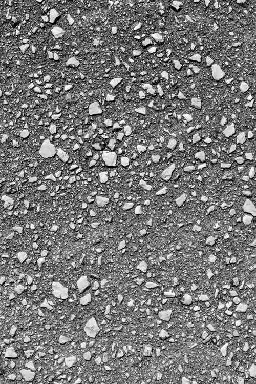 Preview: Grained Texture Of Old Stone Asphalt Closeup For A Background Or For Wallpaper