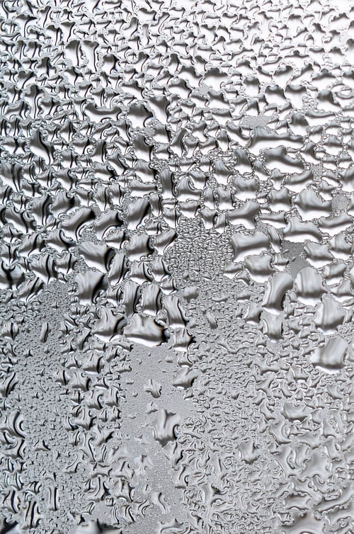 Preview: Texture of a drop of rain on a glass wet transparent background. Toned in grey color