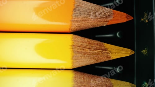 Preview: Crayons in yellow gradient row. Extreme macro shot. Pencils graphite set.