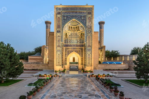 Preview: Exterior view of historic 15th century Madrasa building and courtyard at dusk.